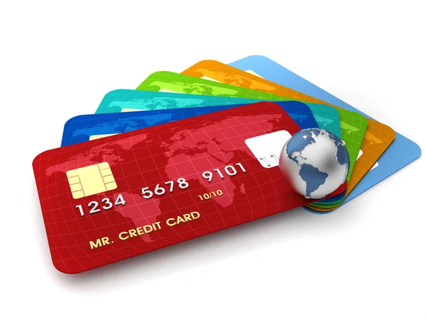 Többféle hitelkártya egy földgömb mellett, utazási költségekhez kapcsolódóan.
