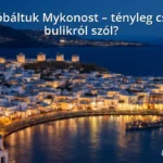 Mykonos island with white houses and blue sea under a sunset sky