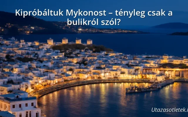 Mykonos island with white houses and blue sea under a sunset sky
